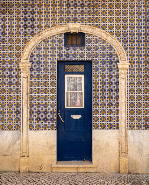 Blue door in ceramic tiled home in Lisbon by Steve Heap