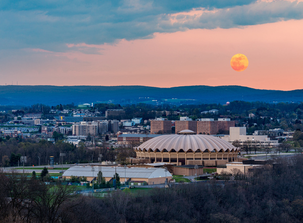Super pink moon rises above the WVU coliseum on Evansdale campus by Steve Heap