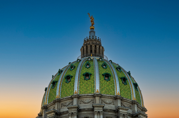 Sun sets behind the ornate dome of Pennyslvania State Capitol by Steve Heap