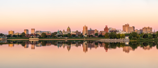 Sunset illuminates the city skyline of Harrisburg in Pennsylvani by Steve Heap