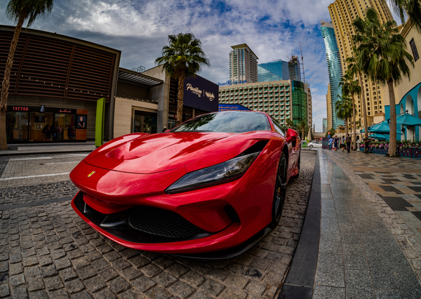 Red Ferrari parked in JBR Beach area of Dubai for rental by Steve Heap