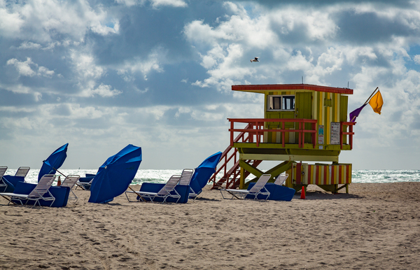 Yellow and green lifeguard station on Miami beach by Steve Heap