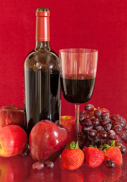 Red wine bottle and fruit with glass by Steve Heap