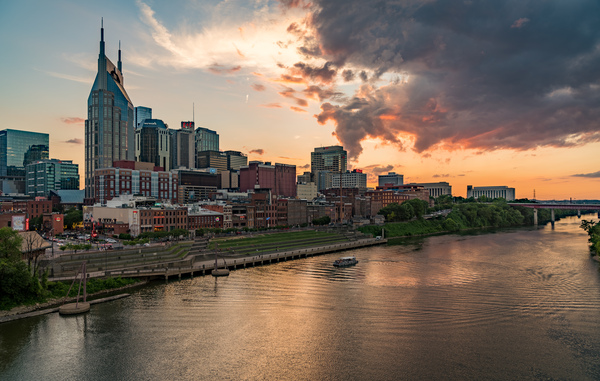 Skyline of Nashville in Tennessee during dramatic sunset over the river by Steve Heap