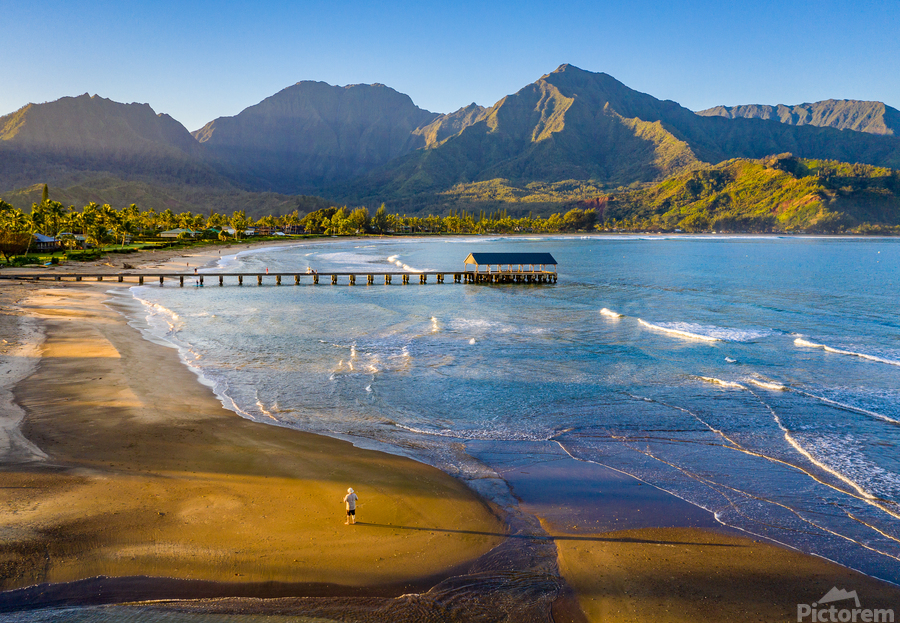 Aerial drone shot of man on the sand of Hanalei beach   Print