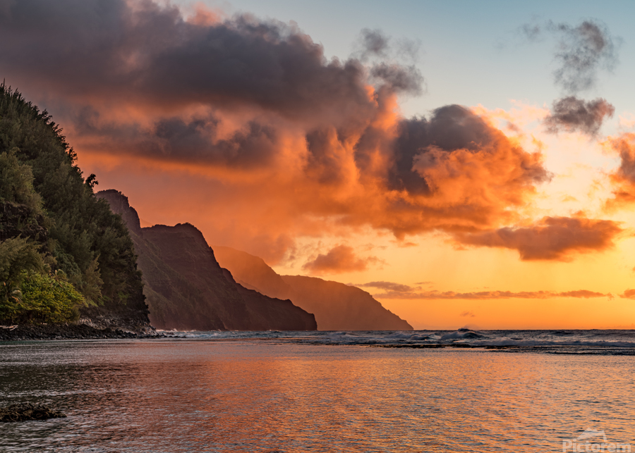 Sunset over the receding mountains of the Na Pali coast of Kauai in Hawaii  Print