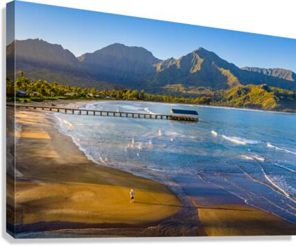 Aerial drone shot of man on the sand of Hanalei beach   Canvas Print