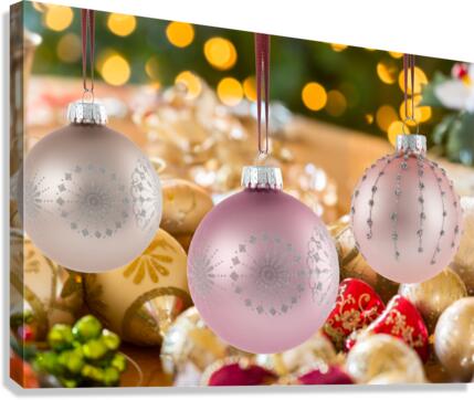 Three Christmas decorations on strings  Canvas Print