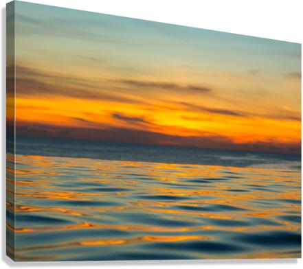 Infinity edge pool with sea underneath sunset  Canvas Print
