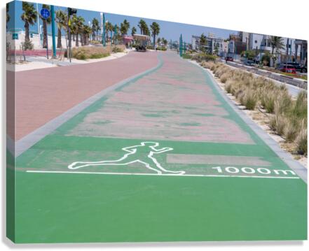 Rubber surface of running track alongside Dubai beach  Canvas Print