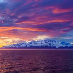 Sunset by Mt Fairweather and the Glacier Bay National Park in Al