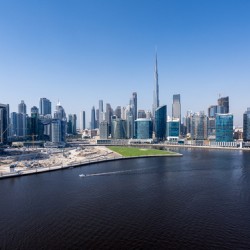 Offices and apartments of Dubai Business Bay with district behin