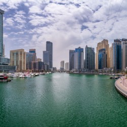 Modern buildings crowd the waterfront at Dubai Marina UAE