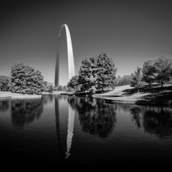 Monochrome Gateway Arch of St Louis Missouri reflecting in the l
