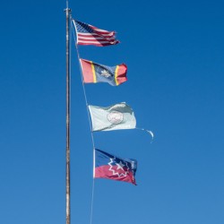 Flagpole with multiple flags in the small town of Greenville MS