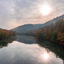 Calm Tygart River by Valley Falls on a misty autumn day