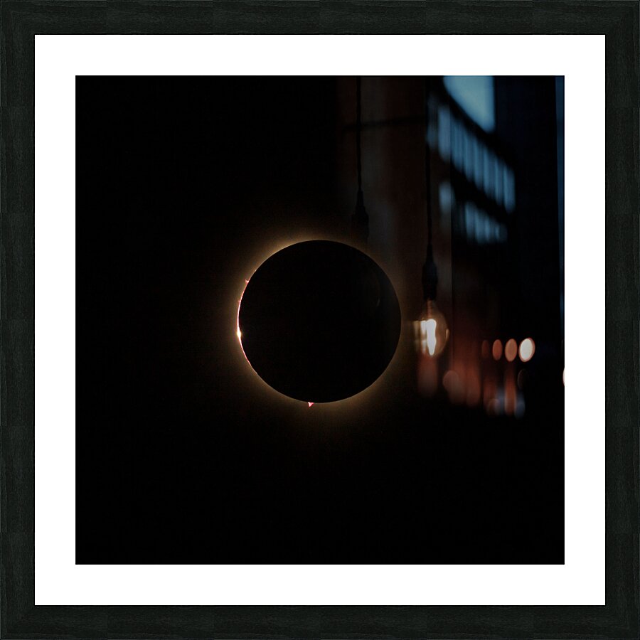 Solar eclipse with the light being seen through lunar canyons.  Framed Print Print