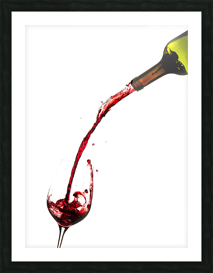 Wine pouring from bottle into glass  Framed Print Print