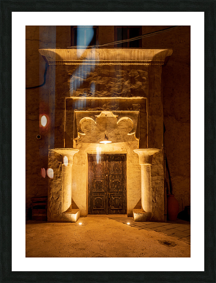 Old buildings and doorways in the Old City in Al Seef are illumi  Framed Print Print