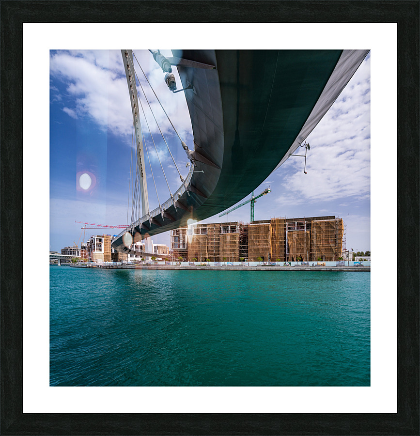 Modern apartments alongside Dubai Canal under Tolerance bridge  Framed Print Print