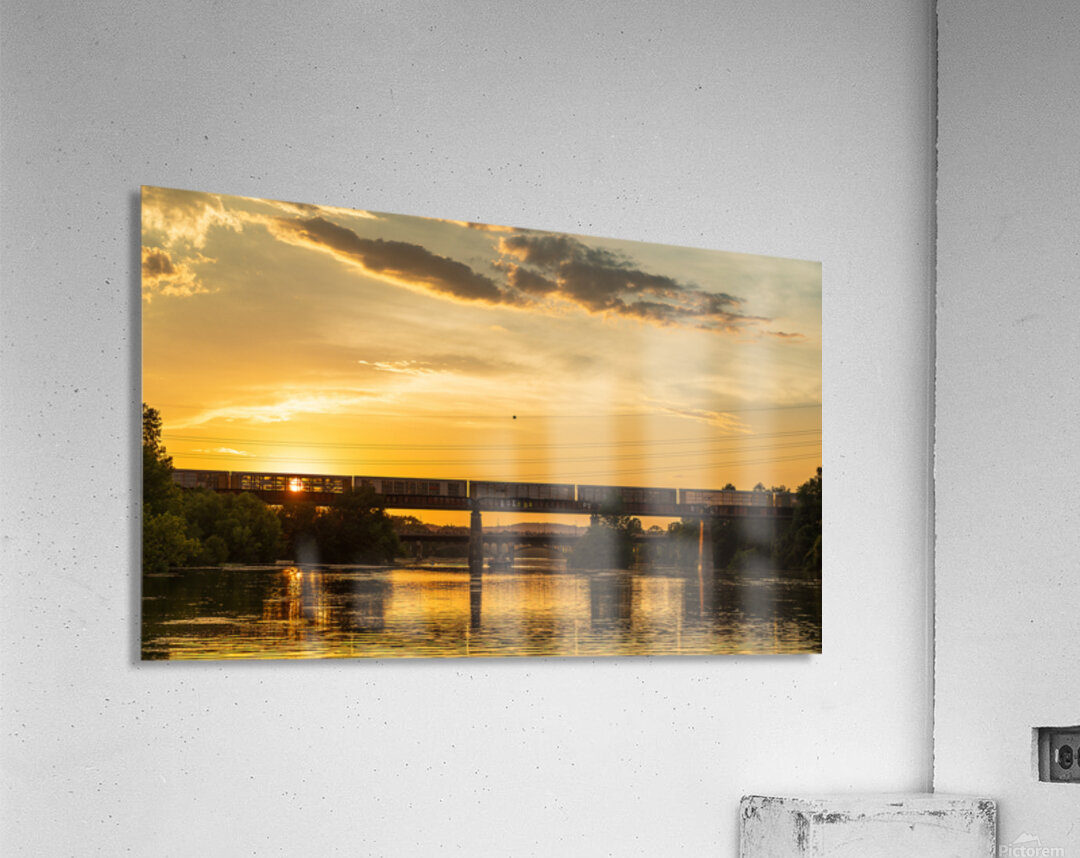 Freight train on the railroad bridge in Austin at sunset Acrylic Print