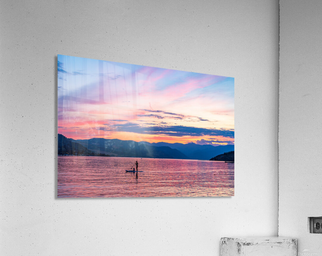 Sunset over Lake Chelan with silhouette of couple paddling on pa Acrylic Print