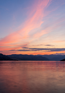 Sunset over Lake Chelan with dramatic sky reflected in long dura