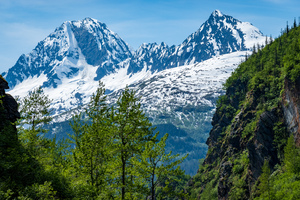 Majestic mountains from Keystone Canyon rise over trees
