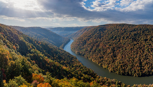  Dramatic sunrise over Cheat River in West Virginia with fall colors