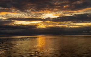 Golden sunset on a cruise on a calm Pacific ocean