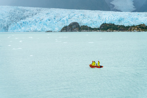 Small boat approaching Amalia Glacier to collect iceberg