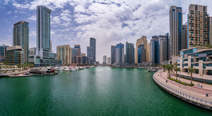 Modern buildings crowd the waterfront at Dubai Marina UAE