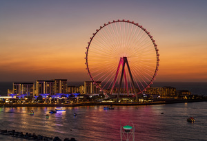 Light show on Ain Dubai observation wheel at sunset
