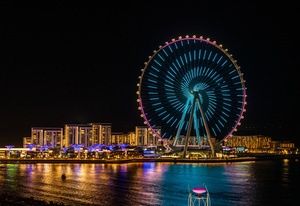 Light show on Ain Dubai observation wheel at sunset