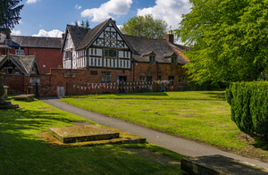 Old School House building in graveyard in Oswestry