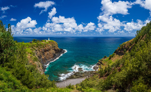 Kilauea lighthouse on headland against blue sky on Kauai