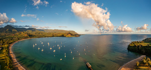 Rainbow over Hanalei bay in panorama across the ocean