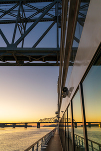 River cruise boat sails under Wabash Railroad bridge