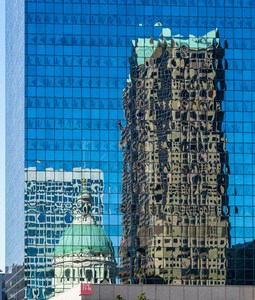 Complex reflections of a modern skyscraper in St Louis office bu