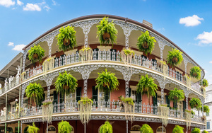 Traditional wrought iron balcony on Royal Street New Orleans hou