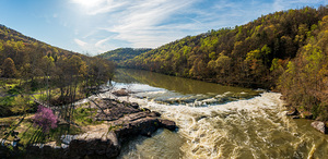 Cascades of flooded Valley Falls on a bright spring morning