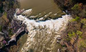 Top down over flooded Valley Falls on a bright spring morning