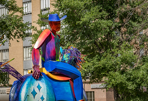 Tracking the end of the rainbow scuplture of cowboy on horse in 
