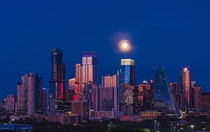 Harvest moon in the Austin skyline at sunset in Texas