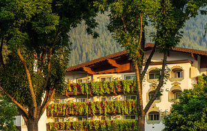 Flower strewn balconies of a hotel in Alpine village of Leavenwo