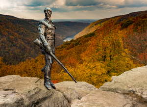 Mountaineer statue from WVU with fall leaves in West Virginia
