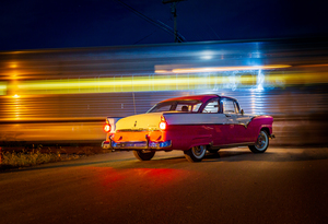 Vintage car at railroad crossing