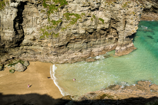 Children playing on beach near Tintagel in Cornwall Print