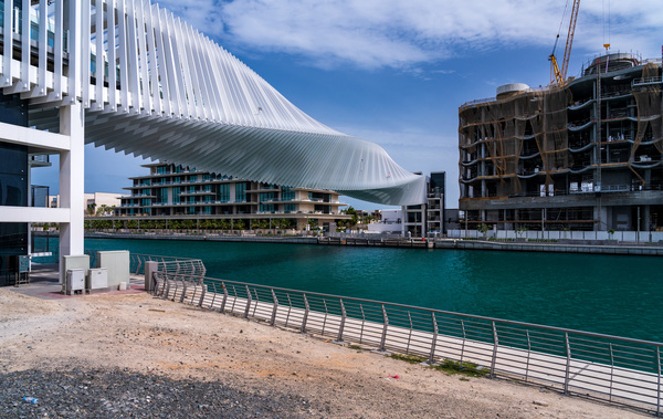 Dubai Water Canal bridge twists towards new apartment blocks Print