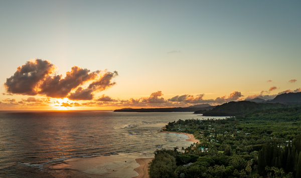 Broad panorama of sunrise over Tunnels Beach Kauai Hawaii by Steve Heap